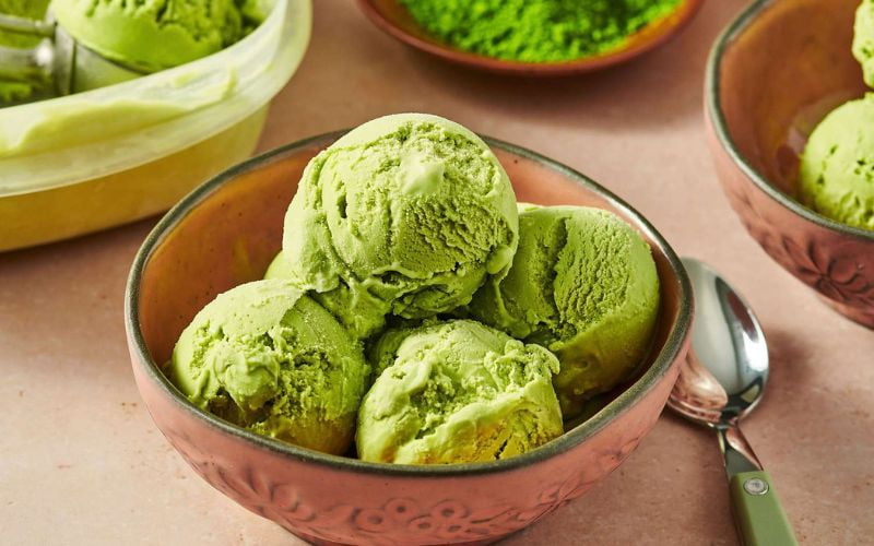 Matcha ice cream scoops in bowl